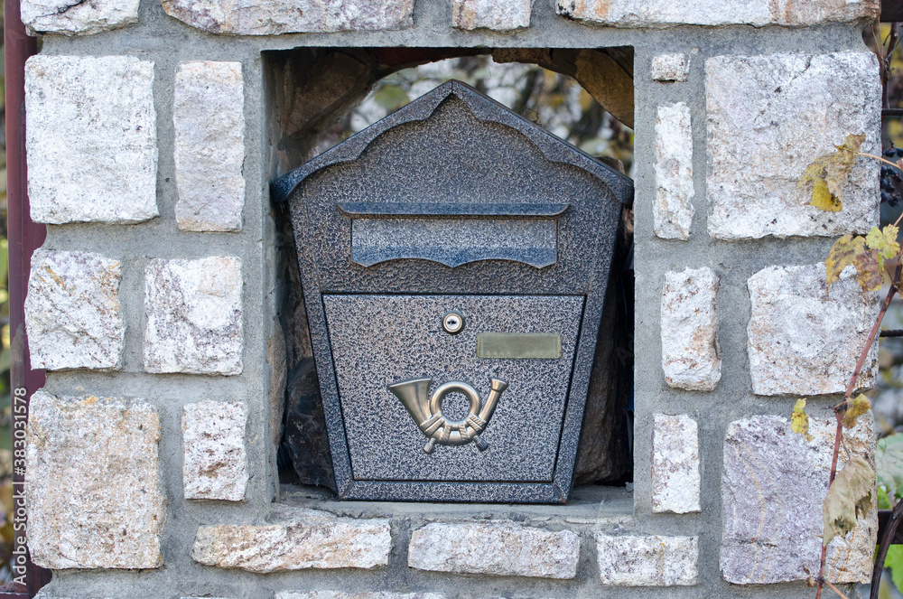 Decorative mailbox on the facade of the house.