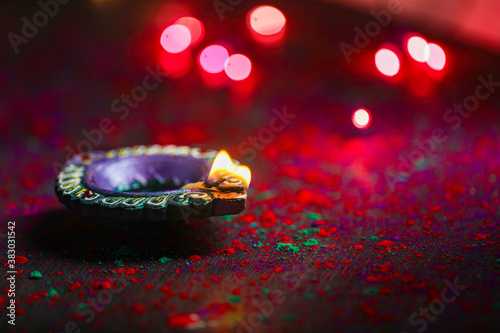 happy diwali or happy deepavali greeting card made using a photograph of diya or oil lamp © PRASANNAPIX