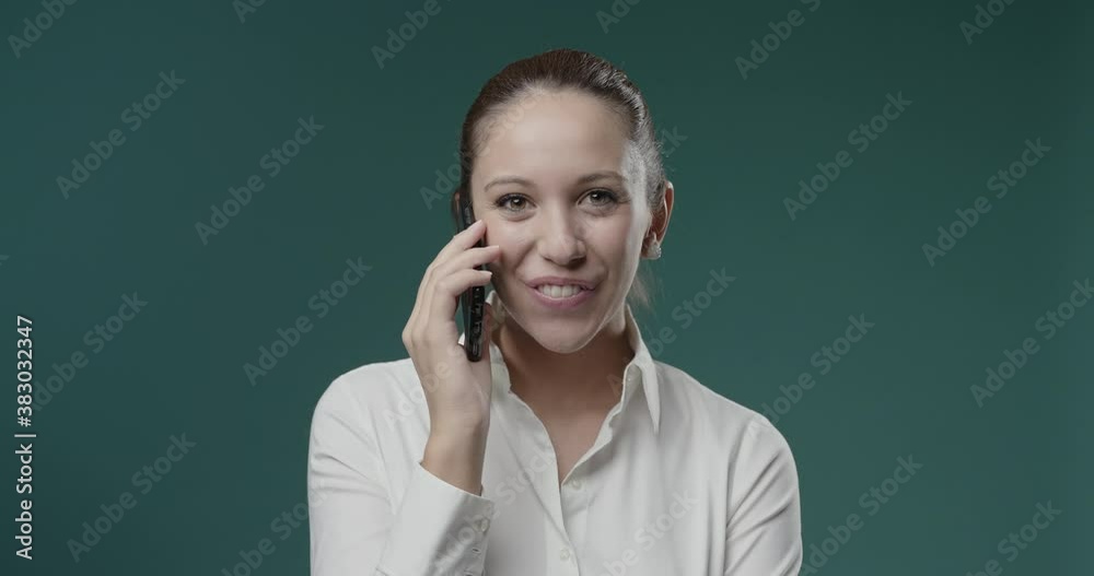 Happy woman talking on the phone Happy woman talking on the phone