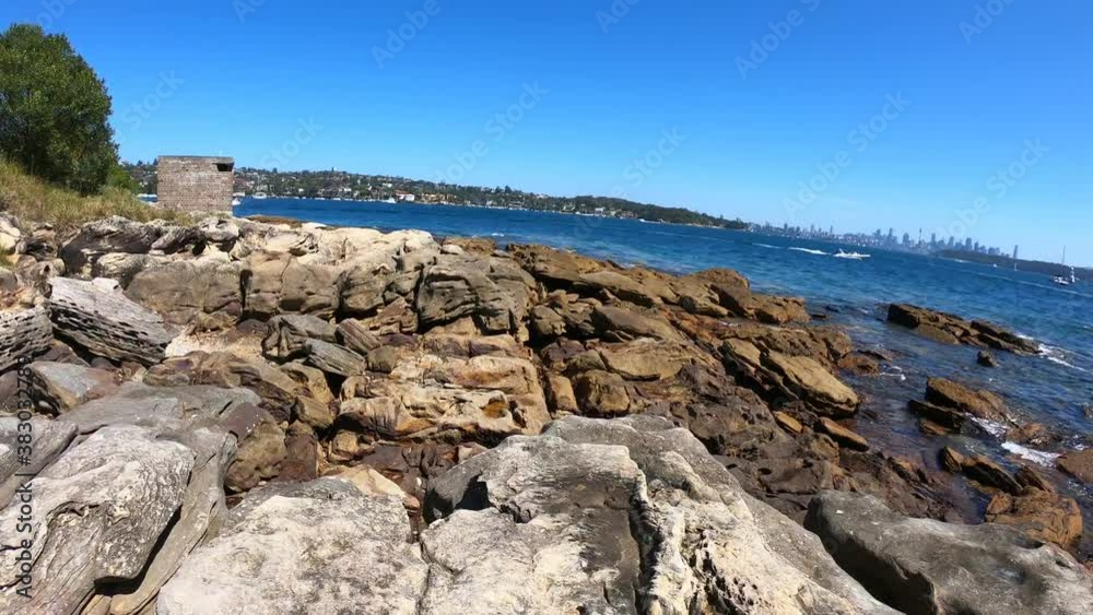 Walking among rocks on a sunny afternoon on the beaches of Australia in early summer Walking among rocks on a sunny afternoon on the beaches of Australia in early summer
