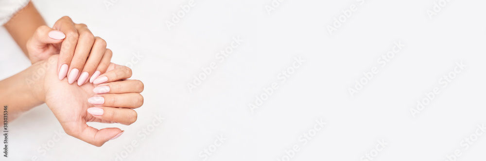 Classic pink wedding nail manicure on white backdrop. Spa treatment concept. Towel background. Natural hygiene. Health care. Beauty spa salon. Salon procedure Woman body care. Classic pink wedding nail manicure on white backdrop. Spa treatment concept. Towel background. Natural hygiene. Health care. Beauty spa salon. Salon procedure Woman body care.