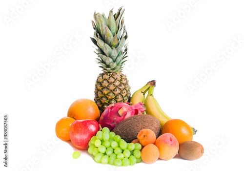 Assortment of various fruits isolated pineapple  bananas  pitaya  green grapes  apple  coconut  peaches  apricots  tangerines and kiwi