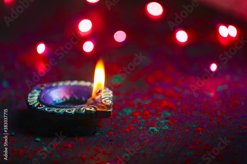 happy diwali or happy deepavali greeting card made using a photograph of diya or oil lamp photo