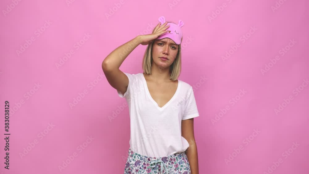 Young cute woman wearing pajama being shocked, she has remembered important meeting Young cute woman wearing pajama being shocked, she has remembered important meeting