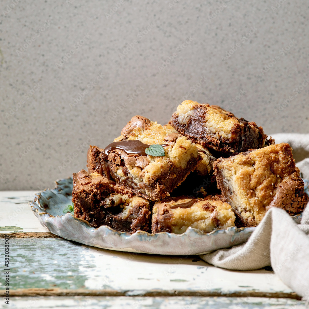 Φωτογραφία Trend baking Brookies chocolate brownies and cookies homemade cake sliced by squares in ceramic plate on old white wooden table
