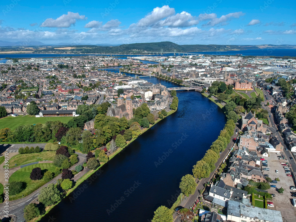 Aerial view of Inverness city, showing the beauty of the River Ness with its famous bridges and landmarks the cathedral and castle in the background