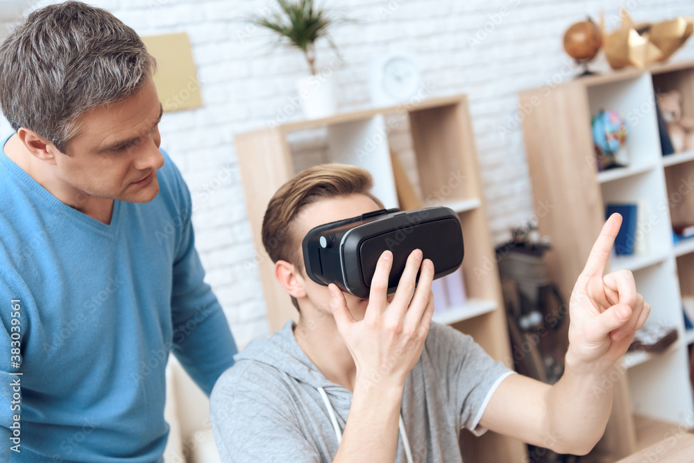 Son is playing on virtual reality. Son is playing on virtual reality.