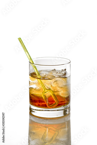 Godfather Cocktail with ice cubes in whiskey glass isolated on white