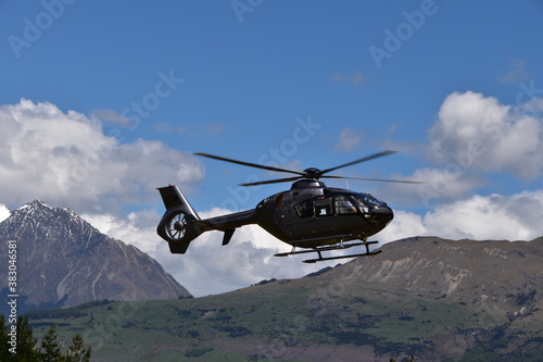 Fototapeta Naklejka Na Ścianę i Meble -  The view of mountains with a helicopter in Queenstown, New Zealand