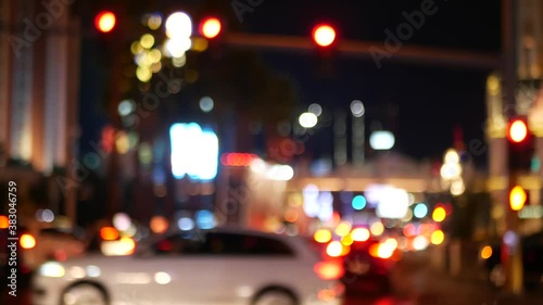 Defocused fabulous Las Vegas Strip boulevard, luxury casino and hotel, gambling area in Nevada, USA. Nightlife and traffic near Fremont street in tourist money playing resort. Neon lights of sin city.