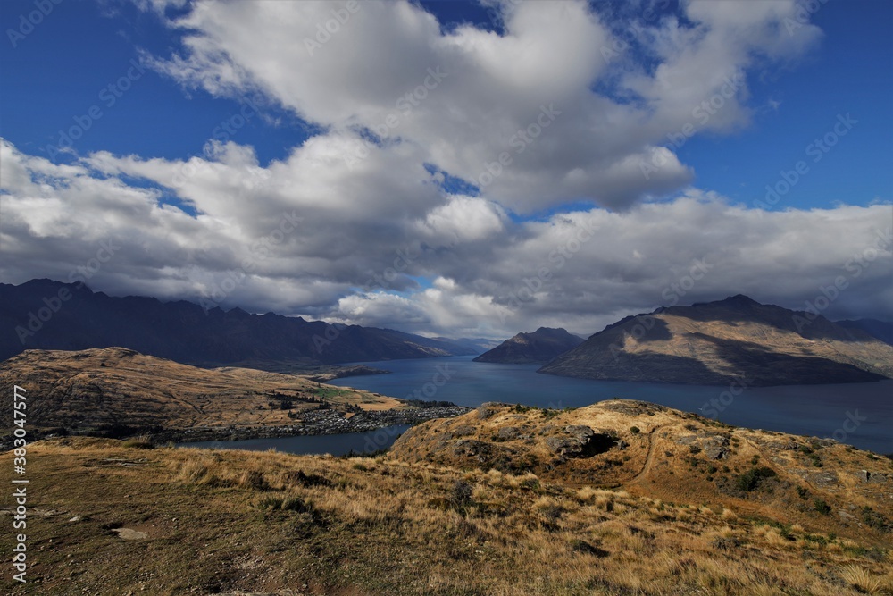 View at the blue and cloudy sky and lake Wakatipu from the Queenstown Hill, New Zealand