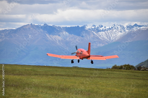 The view of mountains with an airplane in Queenstown, New Zealand