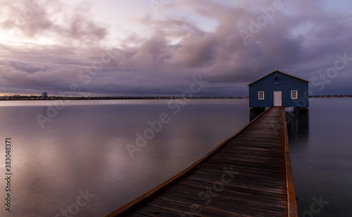 Blue boat shed on a rainy morning on the Swan River in Perth, Western Australia