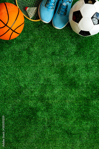Flat lay of sport balls - football  basketball on grass top view copy space