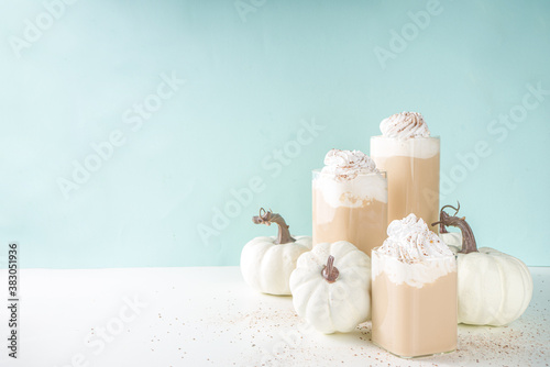 Pumpkin spice latte, with decorative little pumpkins