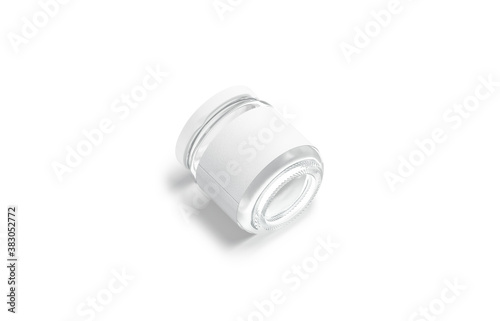Blank small glass jar with white label mockup lying, isolated photo