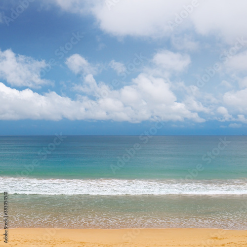 Sea view from beach with sunny sky.