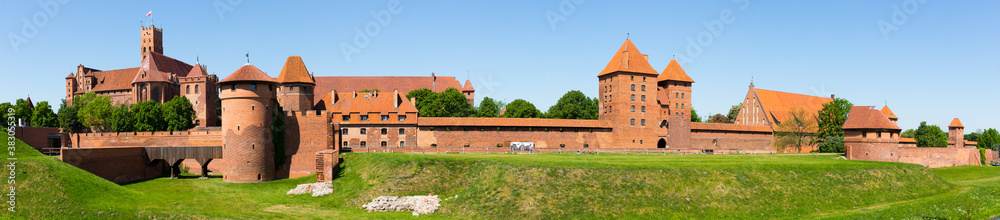 Panoramic view of Castle of Teutonic Order in Malbork, Poland . - obrazy, fototapety, plakaty 