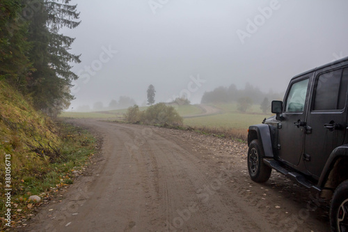 Black SUV on a country road
