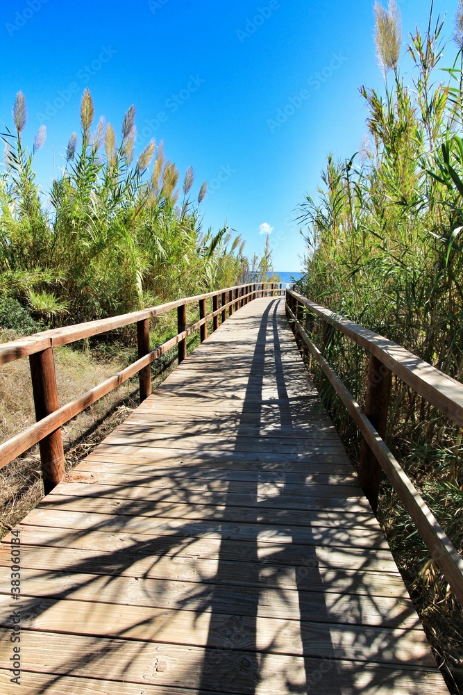 Wooden walkway to the beach in the morning in Alicante, Spain