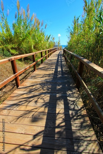 Wooden walkway to the beach in the morning in Alicante, Spain