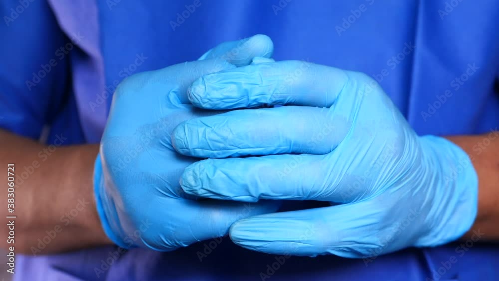 Closeup of doctor hands with protective gloves Closeup of doctor hands with protective gloves