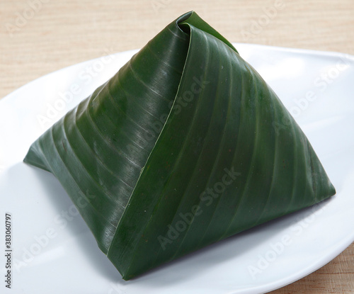 Nasi lemak is a Malay fragrant rice dish cooked in coconut milk and pandan leaf. It is commonly found in Malaysia, where it is considered the national dish.