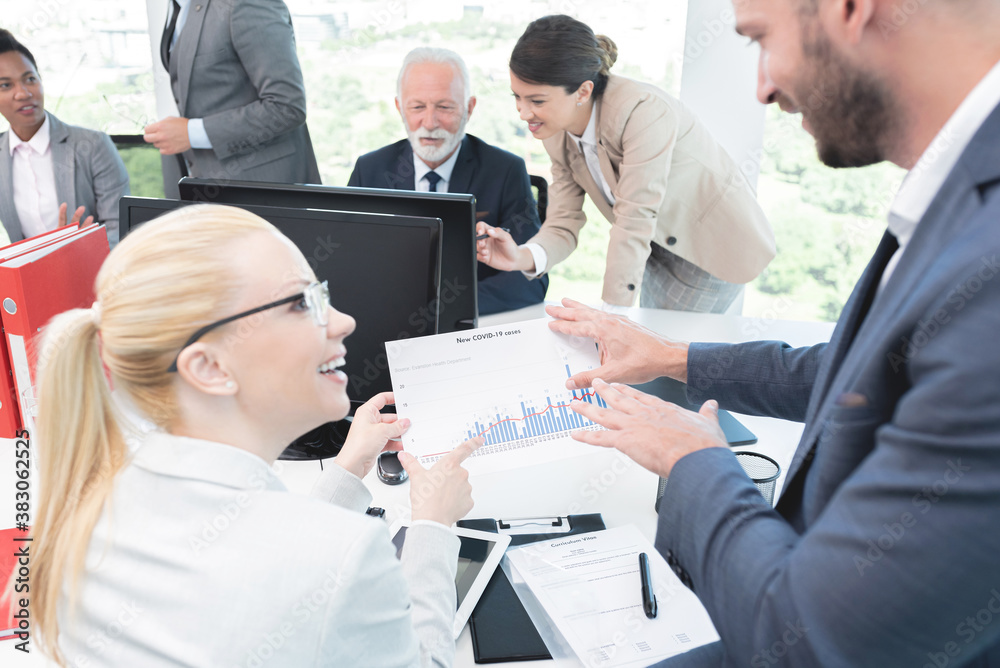 Business people discussing Covid-19 cases Business people discussing Covid-19 cases