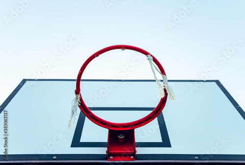 Red basketball hoop with white table. Copy space