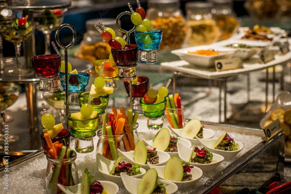 a buffet spread full of bite sized delicious canapes on a table