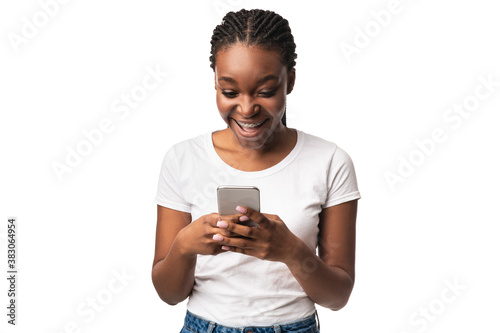 Excited Black Woman With Smartphone Using Application Over White Background