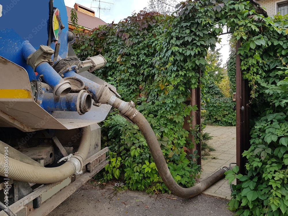 Image of units of a pumping machine for pumping out a septic tank. Sewerage in a private house. Image of units of a pumping machine for pumping out a septic tank. Sewerage in a private house.