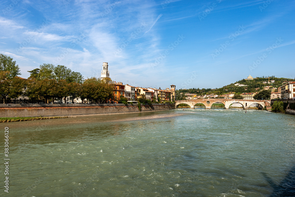 Verona cityscape and the River Adige with the Ponte Pietra (Stone bridge, I century B.C) and bell tower of the Cathedral. UNESCO world heritage site, Veneto, Italy, Europe.