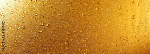 yellow water drops on glass