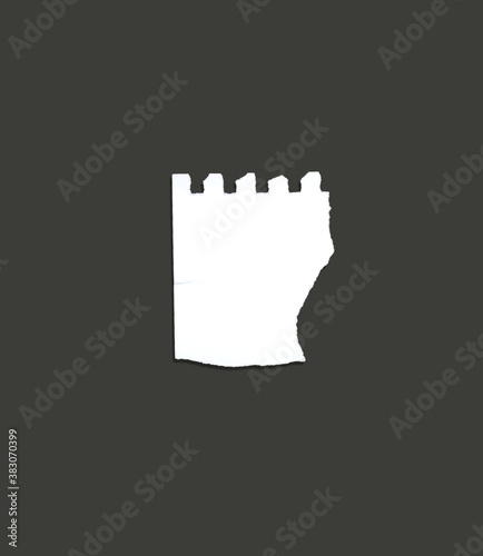 White ripped note, notebook paper stuck with sticky tape on black background.