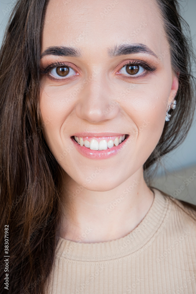 Close-up female positive face with makeup.