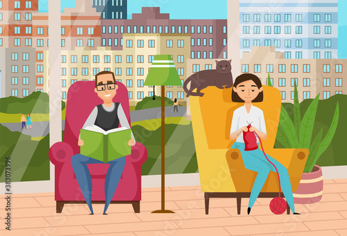 Relaxing at home, adult man and woman sitting in soft comfortable armchairs near panoramic windows, cute cat lying on chair s back, man reading book, woman knitting scarf, leisure time together