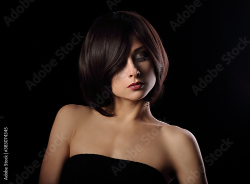Foto Alluring portrait of short bob hair style woman looking down on black background
