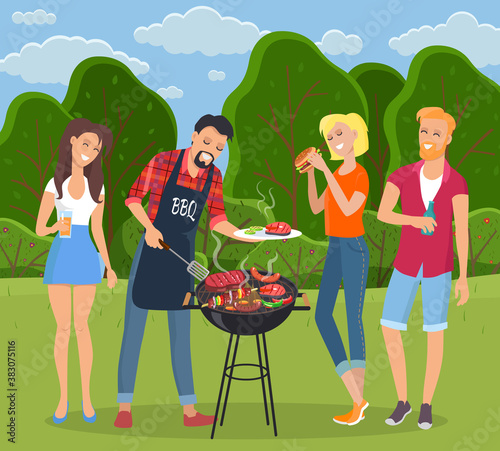 Young people having picnic in countryside. Man in BBQ apron grilling barbecue. Plate with meat. Girl has hamburger, female drinks cola, bearded red-haired man drinks beer or water. Green landscape