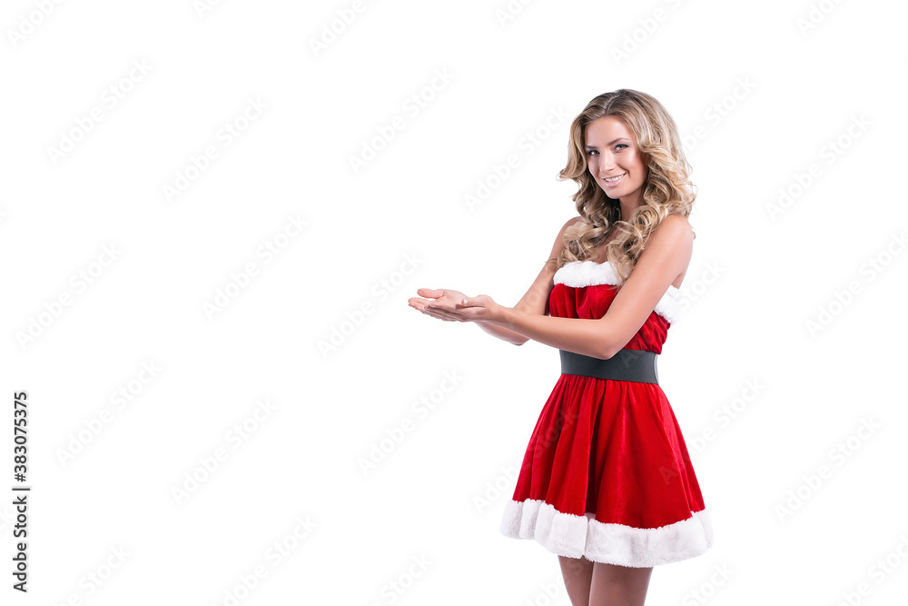 Portrait of a cheerful young blonde woman in red santa claus dress posing over white background. Portrait of a cheerful young blonde woman in red santa claus dress posing over white background.