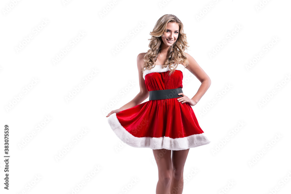 Portrait of a cheerful young blonde woman in red santa claus dress posing over white background. Portrait of a cheerful young blonde woman in red santa claus dress posing over white background.