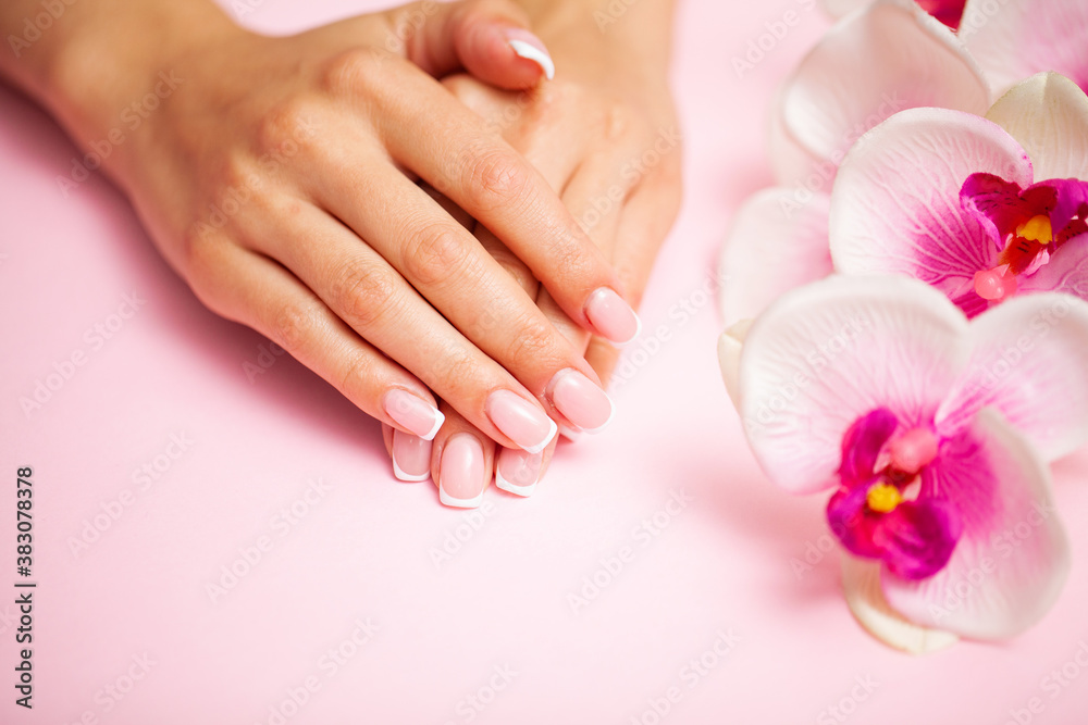 Young woman after getting professional manicure in beauty salon