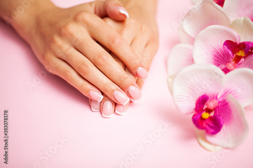 Young woman after getting professional manicure in beauty salon