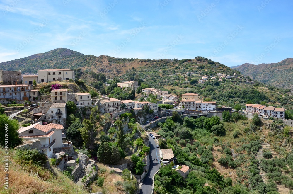 Medieval mountain village of Savoca in Sicily with its Bar Vitelli in centre, known as movie location of Godfather, a sunny day in summer, panoramic view