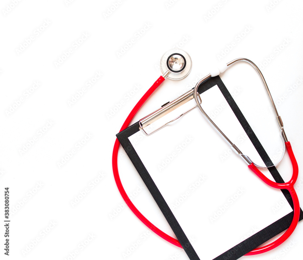 Blank medical clipboard with red stethoscope on white background. Copy space. Blank medical clipboard with red stethoscope on white background. Copy space.