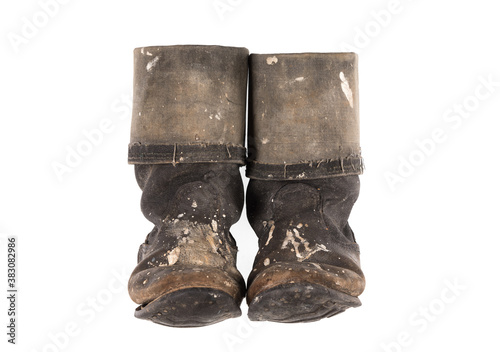 old tarpaulin boots isolated on white background