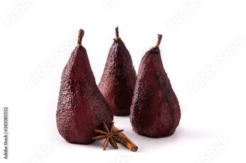 Poached pears in red wine isolated on white background. 