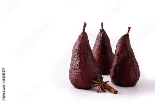 Poached pears in red wine isolated on white background. Copy space 