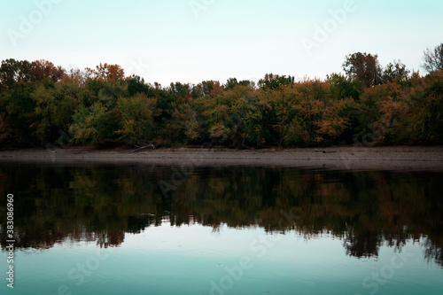 reflection of trees in the lake © Joshua