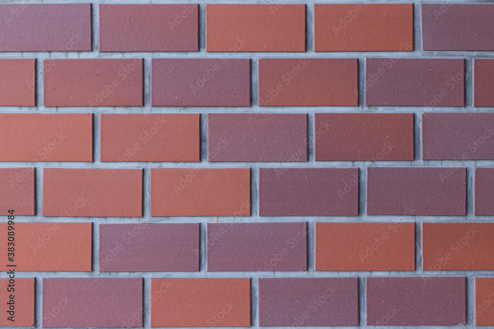 Obraz premium 赤茶色のレンガの壁。